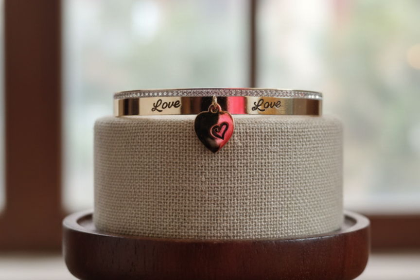 Rose gold bangle engraved with Love