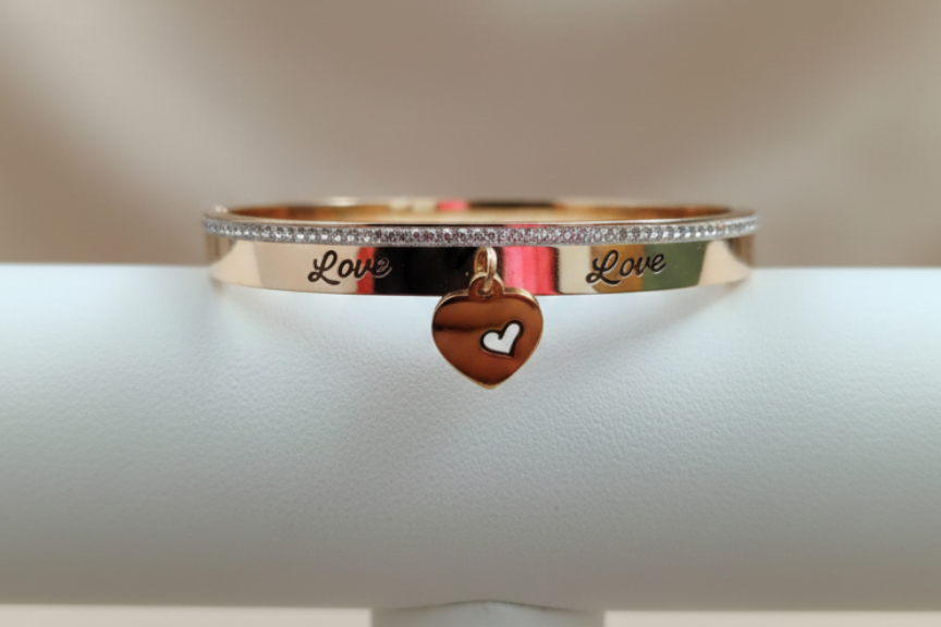 Rose gold bangle engraved with Love