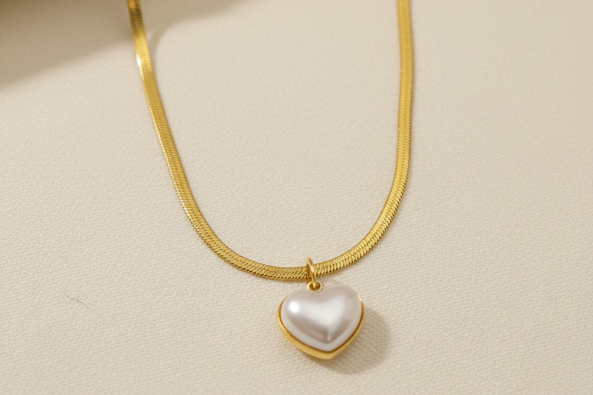 Chain with heart shaped pearl pendant