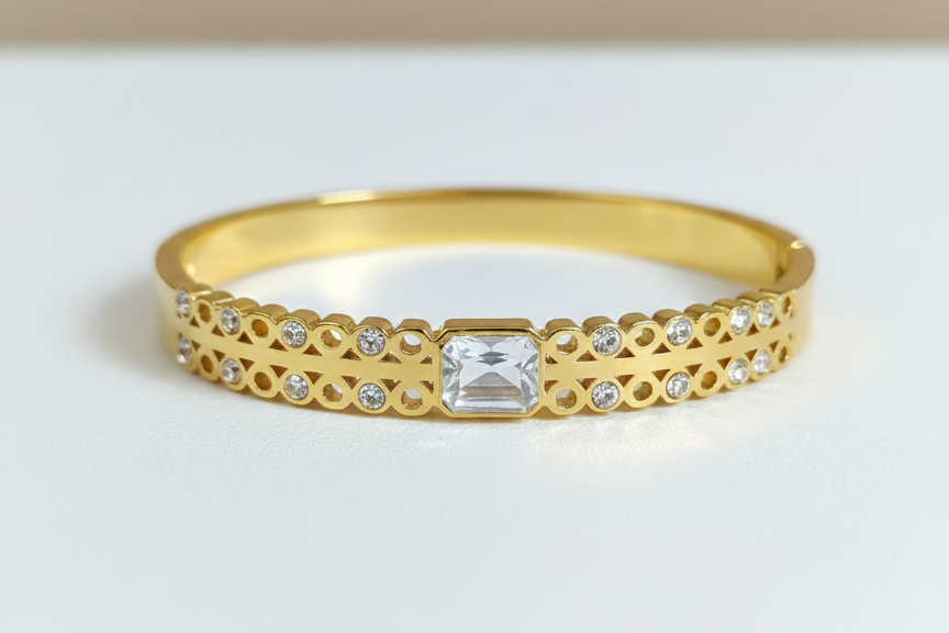 Gold bangle with  white stones