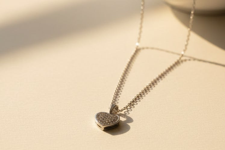 Necklace with a heart-shaped pendant on a beige surface